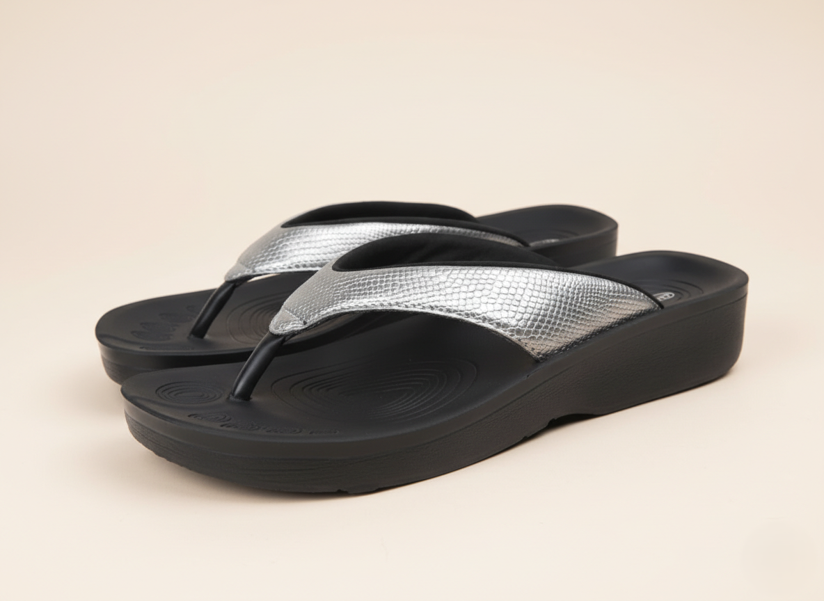 collection image showcasing pair of Aerothotic silver flip flops